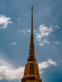 Low angle view of tower of building against cloudy sky