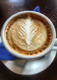 High angle view of cappuccino on table