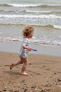 Full length of boy on beach