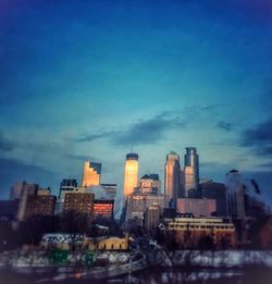 City skyline against cloudy sky