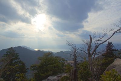 Scenic view of landscape against cloudy sky