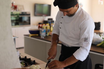 Man preparing food at kitchen