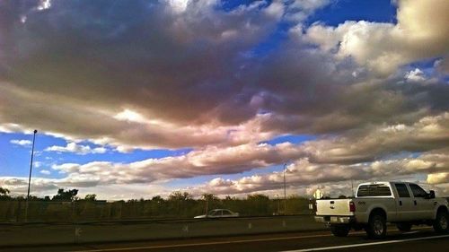 View of road against cloudy sky