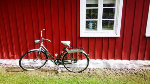 Bicycle parked by building