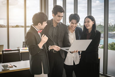 Group of people holding smart phone