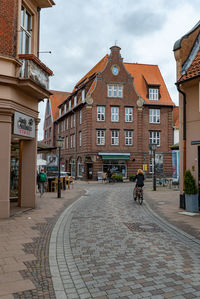 People walking on street in city