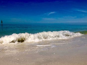 Scenic view of sea against blue sky