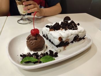 Midsection of cake slice in plate on table