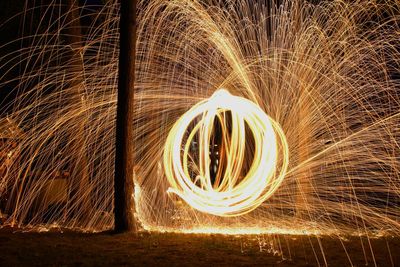 Spinning illuminated wire wool at night