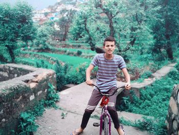 Portrait of man riding bicycle