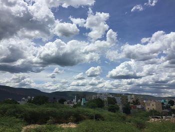 Houses and buildings against sky