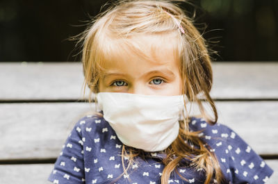 Portrait of cute girl wearing mask