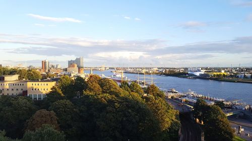 High angle view of trees and buildings against sky