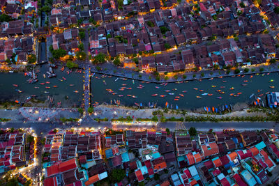 High angle view of illuminated buildings in city at night