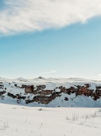 Scenic view of snow covered mountain against sky