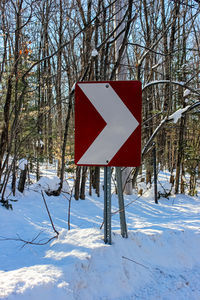 Information sign on snow covered field