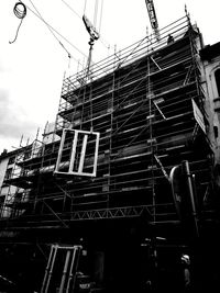 Low angle view of construction site against sky