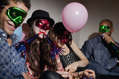 Portrait of people with balloons at nightclub