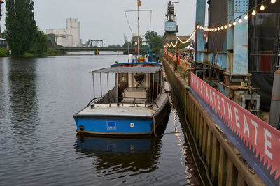 Boat moored at harbor