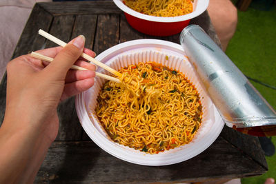 Woman eating noodles