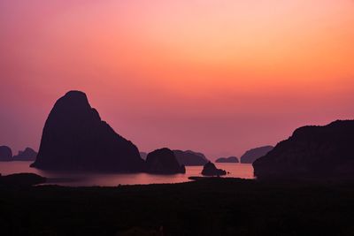 Scenic view of sea against orange sky