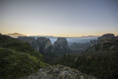 Scenic view of landscape against clear sky during sunset