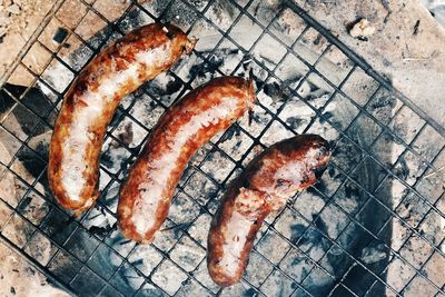 High angle view of meat on barbecue grill