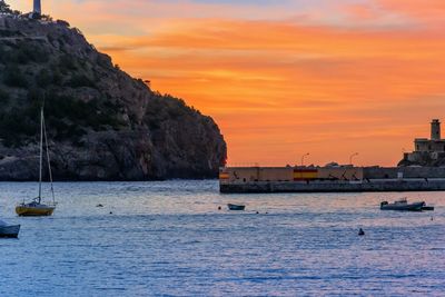 Scenic view of sea against orange sky