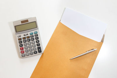 High angle view of pen on table against white background