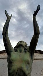 Low angle view of statue against sky