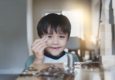 Portrait of cute boy on table