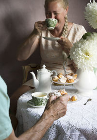 Tea break in the english style,still life with flowers and donuts in the morning