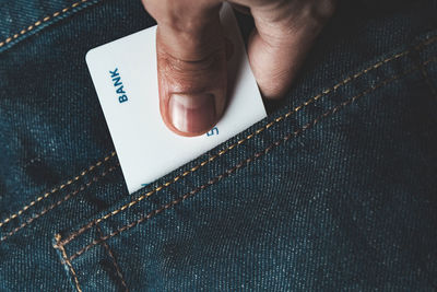 Close-up of person hand with text