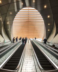 People on escalator at subway station