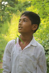 Portrait of teenage boy looking away