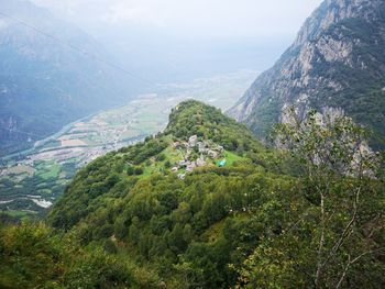 High angle view of trees and mountains against sky