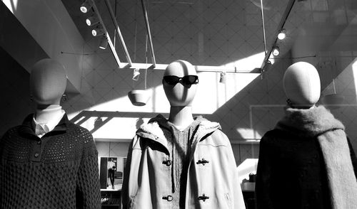 Rear view of man standing against ceiling