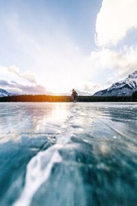 Woman ice-skating on rink