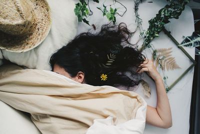 Midsection of woman with plants around 