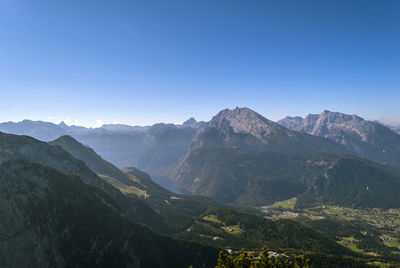 Scenic view of mountains against clear blue sky