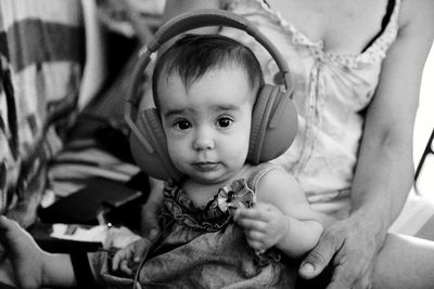 Portrait of baby girl with headphones