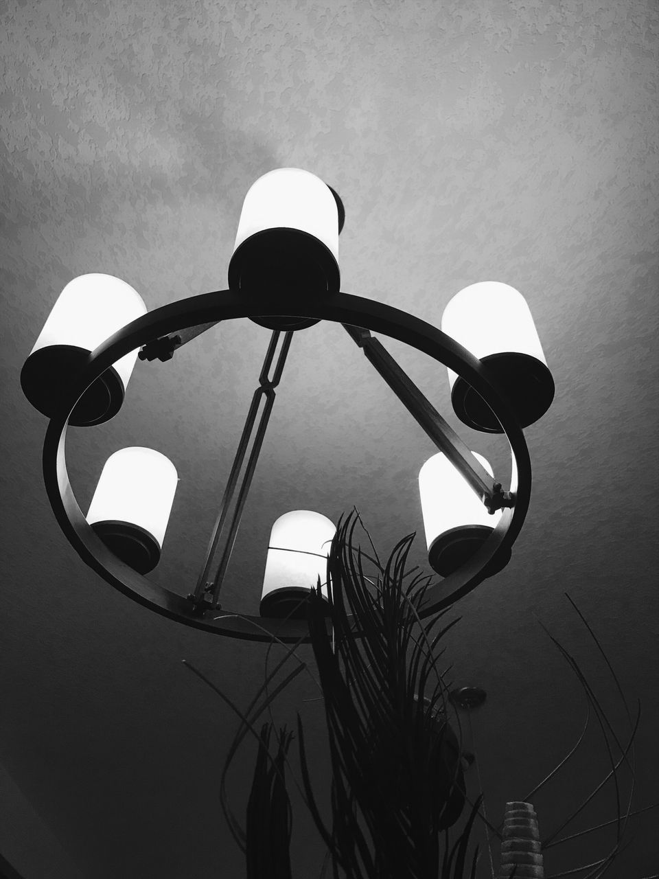 LOW ANGLE VIEW OF ILLUMINATED LIGHT BULB AGAINST SKY