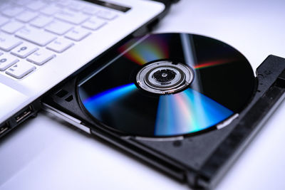 High angle view of compact disc in laptop cd player