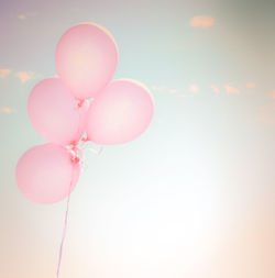 Low angle view of pink balloons