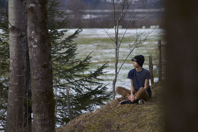 Man sitting outdoors during winter
