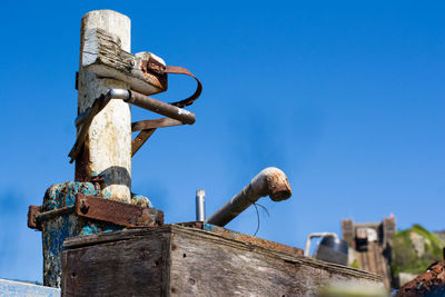 Low angle view of built structure against clear blue sky