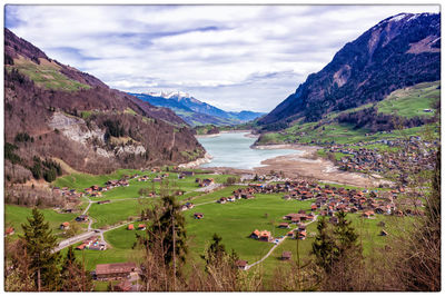 Scenic view of landscape and mountains against sky
