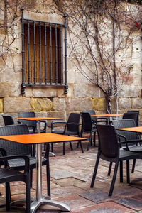 Chairs and table at sidewalk cafe