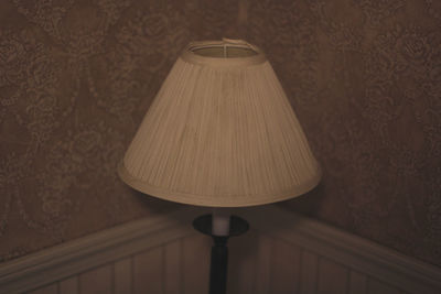 Close-up of illuminated lamp at home