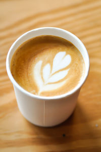 High angle view of cappuccino on table